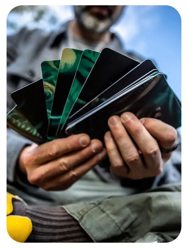Hands holding fan of Spirit Medicine oracle cards